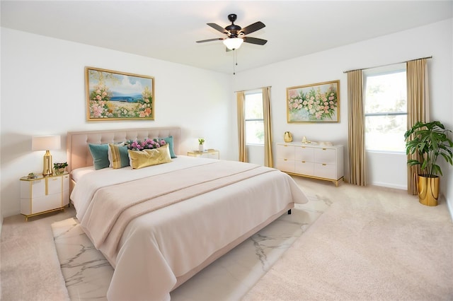 carpeted bedroom with ceiling fan