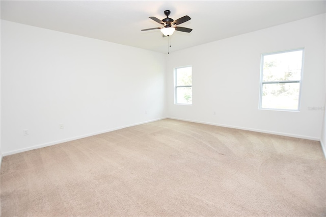 carpeted empty room with ceiling fan