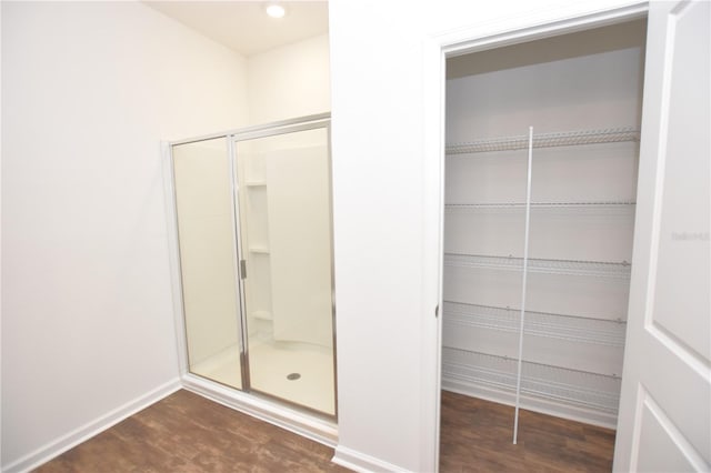 bathroom with hardwood / wood-style flooring