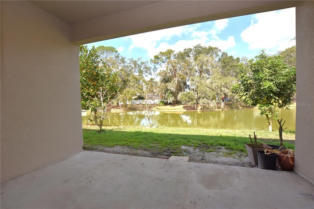 view of patio with a water view