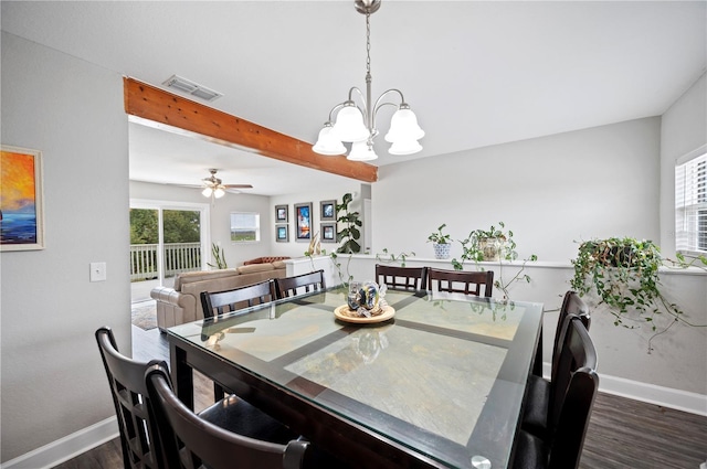 dining room featuring beamed ceiling, a healthy amount of sunlight, dark hardwood / wood-style floors, and ceiling fan with notable chandelier