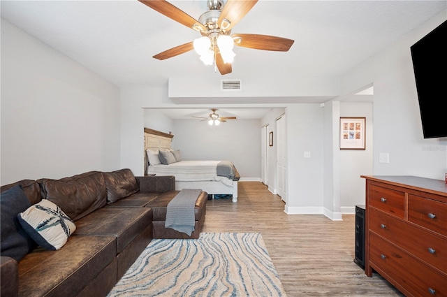 bedroom featuring light hardwood / wood-style flooring and ceiling fan