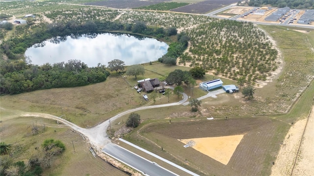 drone / aerial view featuring a rural view and a water view