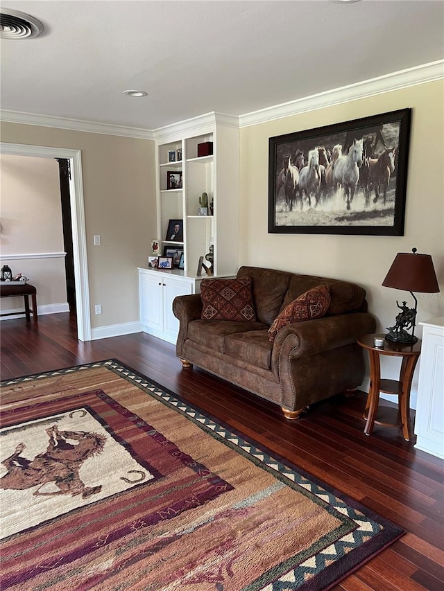 living room with crown molding and dark hardwood / wood-style floors