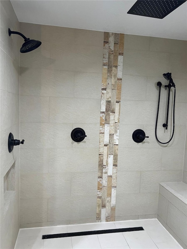 bathroom with a tile shower