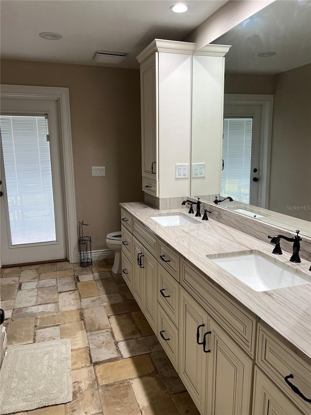 bathroom with vanity and toilet