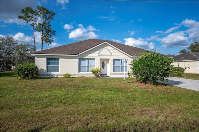 ranch-style house with a front lawn