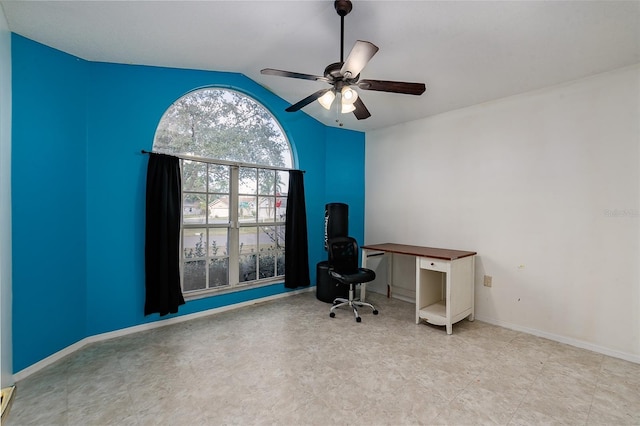 unfurnished office featuring lofted ceiling and ceiling fan