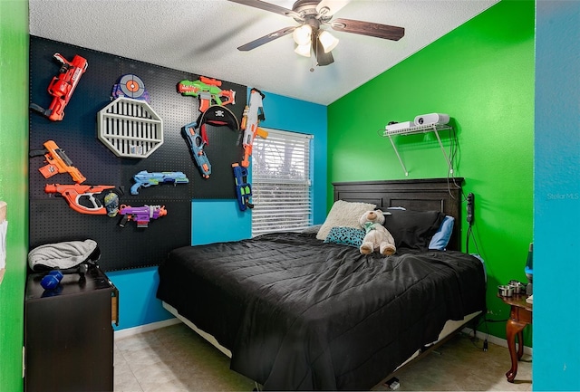 bedroom featuring a textured ceiling and ceiling fan