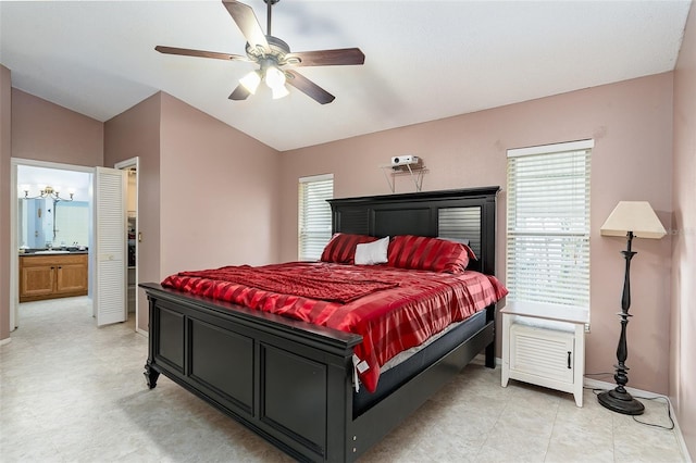 bedroom with lofted ceiling, multiple windows, and ceiling fan