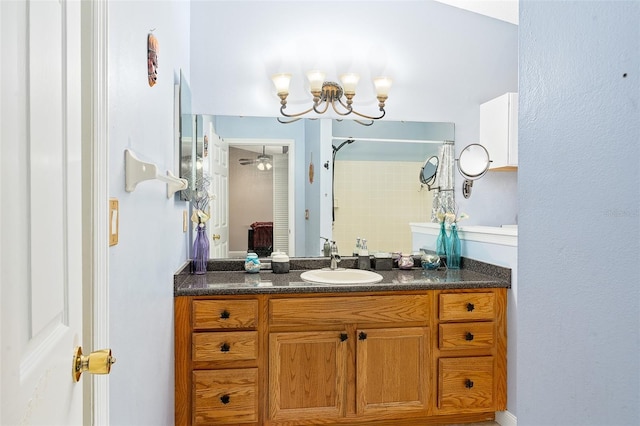 bathroom with vanity and a shower