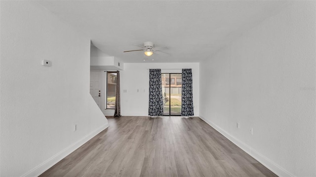 spare room featuring ceiling fan and light wood-type flooring