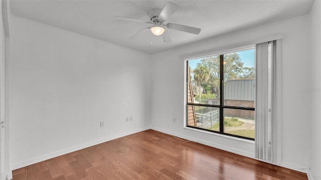 unfurnished room featuring hardwood / wood-style flooring and ceiling fan