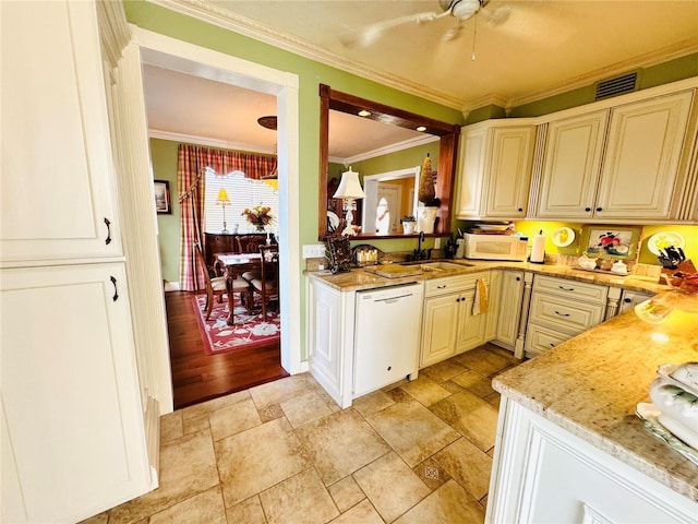 kitchen with crown molding, sink, white appliances, and light stone countertops