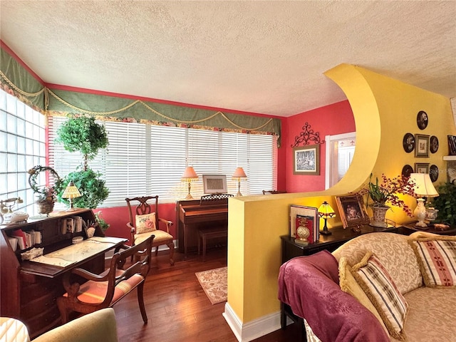 living room with hardwood / wood-style flooring, lofted ceiling, and a textured ceiling