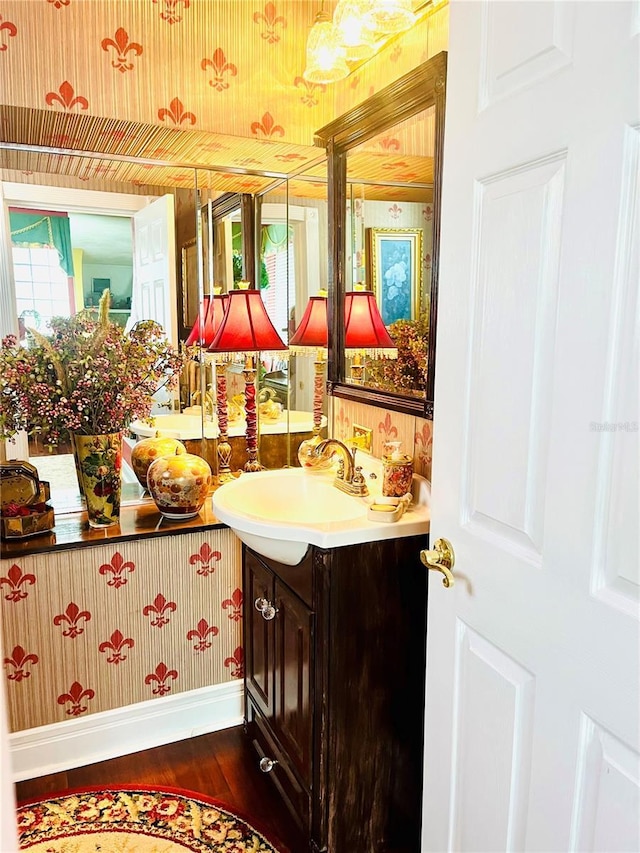 bathroom with vanity and hardwood / wood-style floors