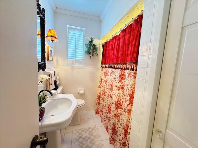 bathroom featuring sink, tile walls, ornamental molding, toilet, and tile patterned floors