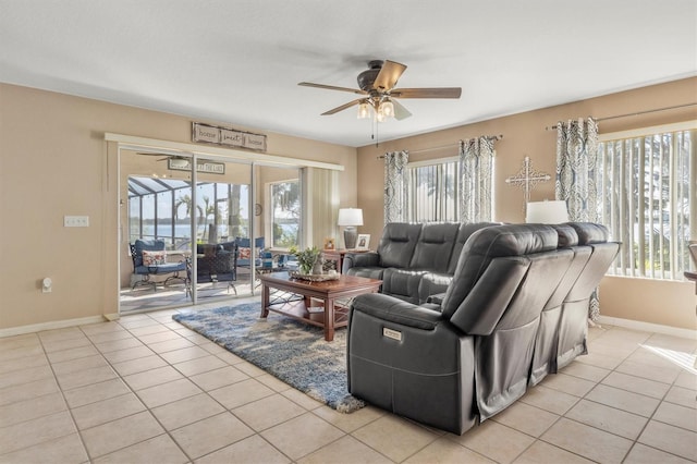 tiled living room featuring ceiling fan