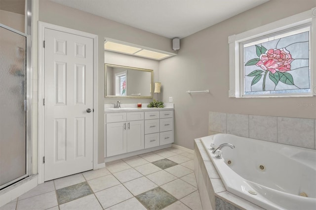 bathroom with tile patterned floors, separate shower and tub, vanity, and plenty of natural light