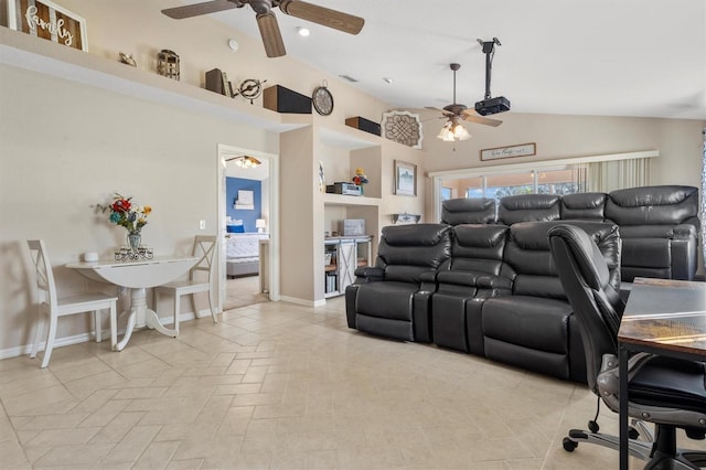 home theater room featuring visible vents, baseboards, a ceiling fan, and vaulted ceiling
