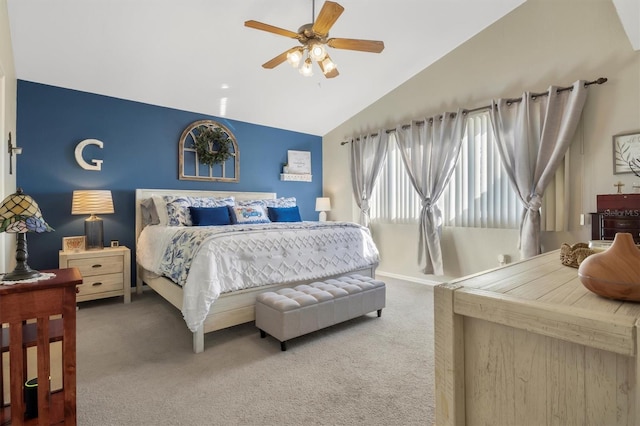 bedroom with baseboards, light carpet, a ceiling fan, and vaulted ceiling