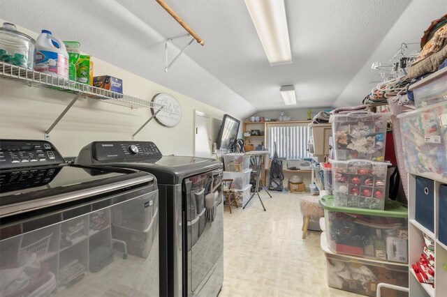 clothes washing area featuring independent washer and dryer and laundry area