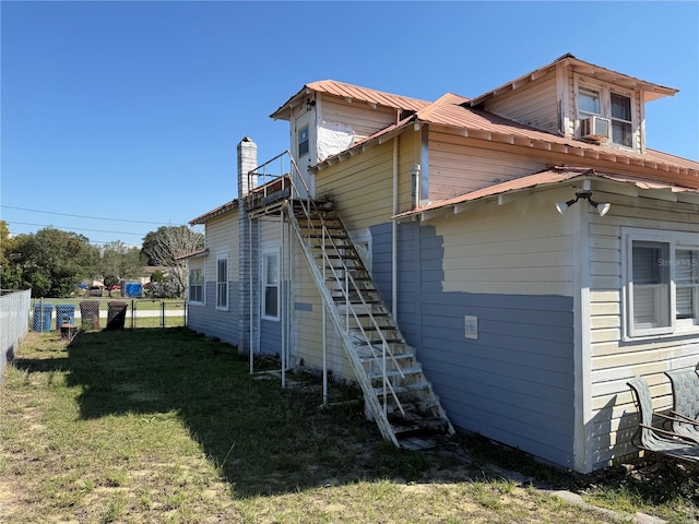 view of home's exterior with a yard