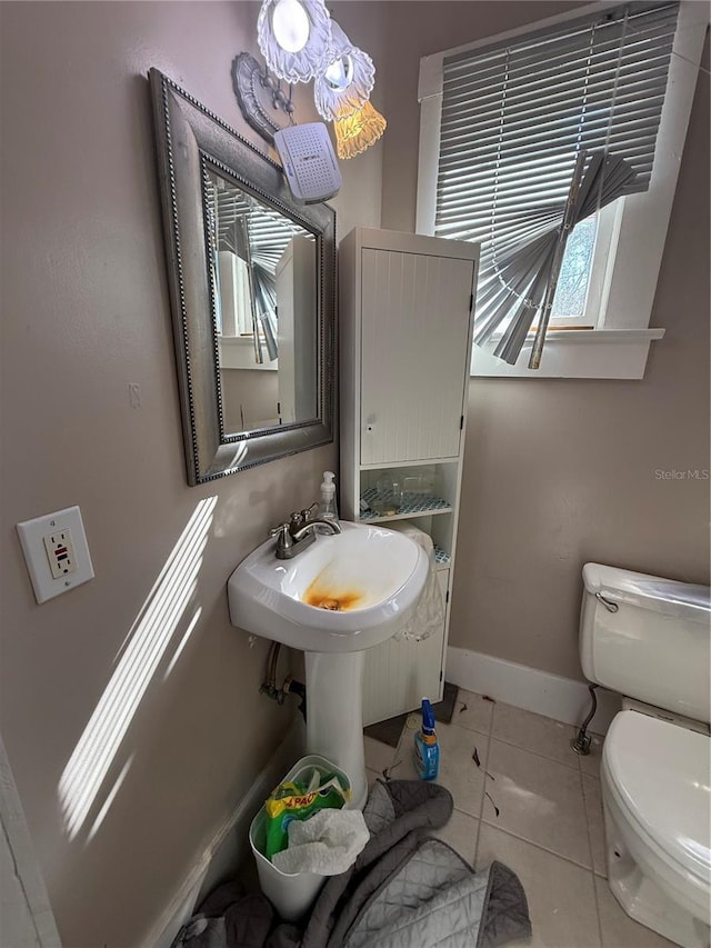 bathroom with tile patterned floors and toilet