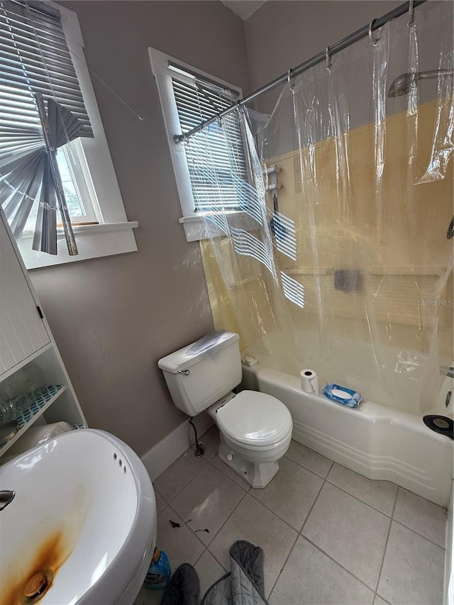 full bathroom featuring tile patterned flooring, sink, toilet, and shower / bath combo