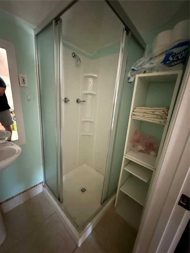 bathroom featuring tile patterned flooring and walk in shower