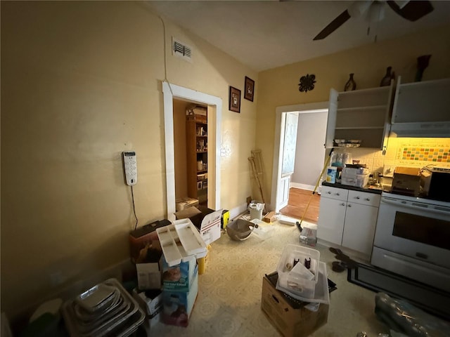 kitchen with ceiling fan, white electric range, and backsplash