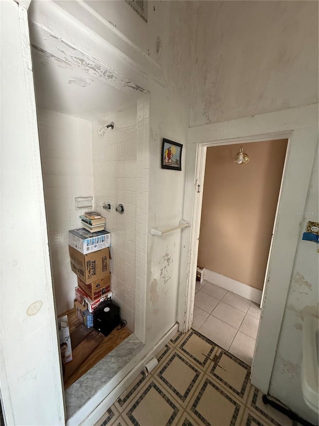 bathroom with tile patterned flooring