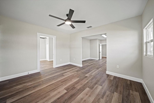 spare room featuring hardwood / wood-style flooring and ceiling fan