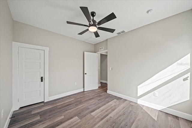 unfurnished bedroom featuring hardwood / wood-style floors and ceiling fan