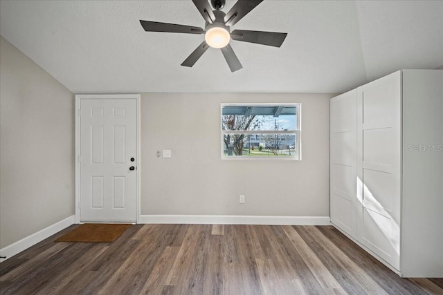 entryway featuring ceiling fan, hardwood / wood-style floors, and a textured ceiling