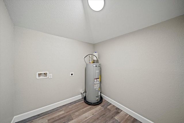 utility room featuring water heater