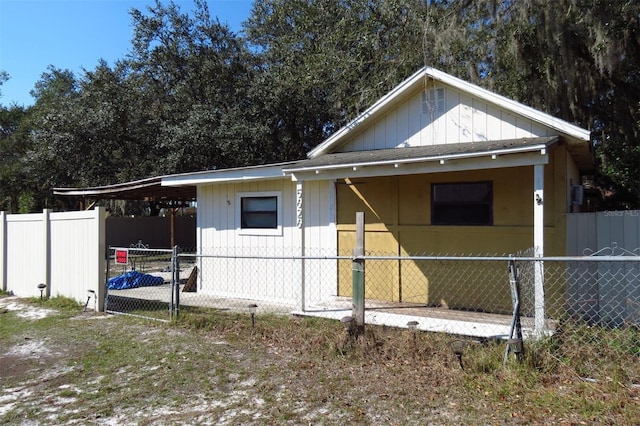 view of side of property with a carport