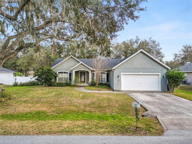 ranch-style house featuring a garage and a front yard