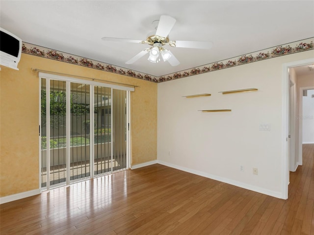 unfurnished room with hardwood / wood-style flooring and ceiling fan