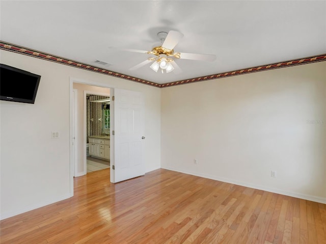 unfurnished room featuring ceiling fan and light wood-type flooring