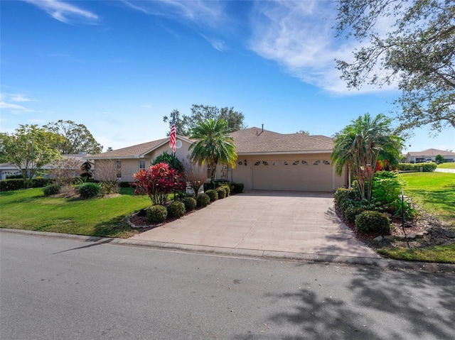 single story home with a garage and a front yard