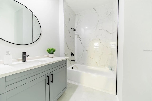 bathroom with marble finish floor, vanity, and  shower combination