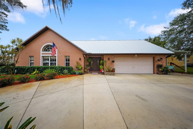 ranch-style home featuring a garage