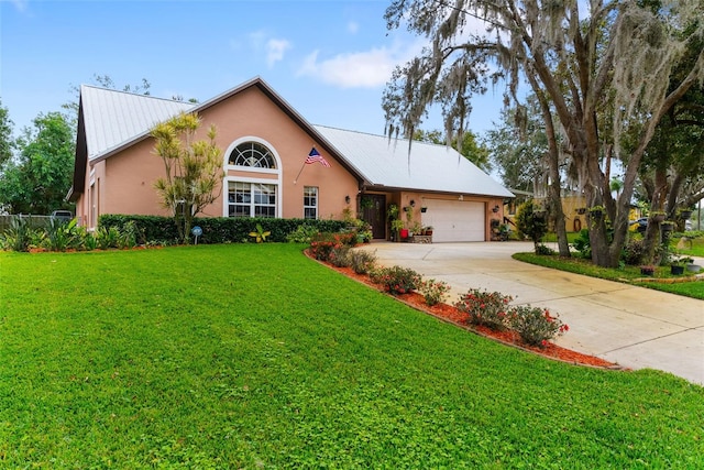 view of front of home featuring a garage and a front lawn