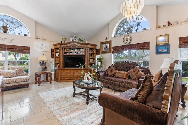 living room featuring high vaulted ceiling and a notable chandelier