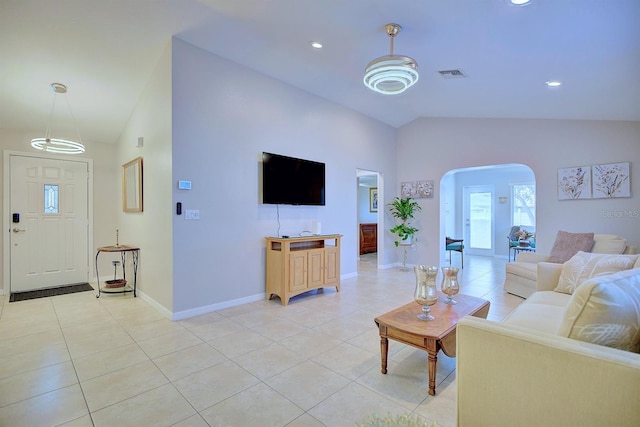 tiled living room with lofted ceiling