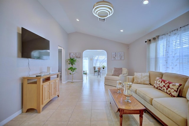 tiled living room with vaulted ceiling