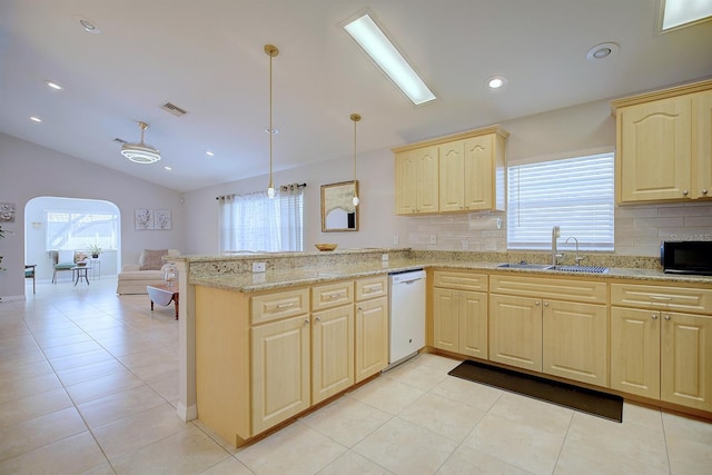 kitchen with lofted ceiling, sink, hanging light fixtures, white dishwasher, and kitchen peninsula