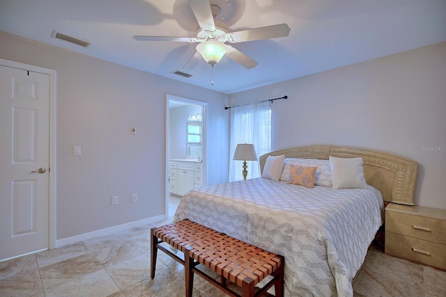 bedroom with ceiling fan and connected bathroom