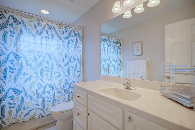 bathroom featuring vanity and toilet